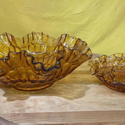 Two Fenton Glass amber thumbprint pattern bowls with ruffled edges