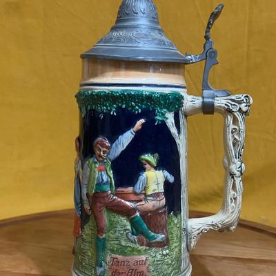 Vintage German ceramic beer stein with pewter lid and relief scene