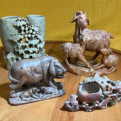 Collection of Chinese carved soapstone animal figurines and brush pot