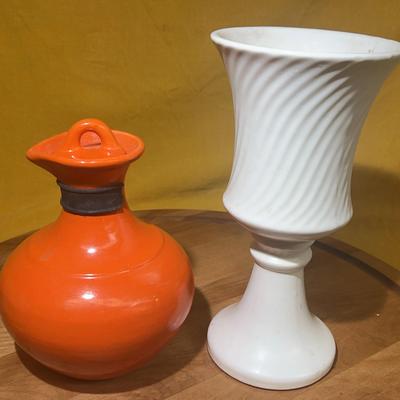 Pair of mid-century decorative ceramic vases, one orange pitcher and one white swirl vase