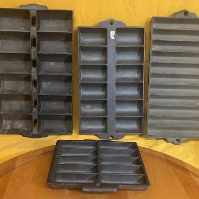 Vintage cast iron muffin, roll, and loaf baking molds