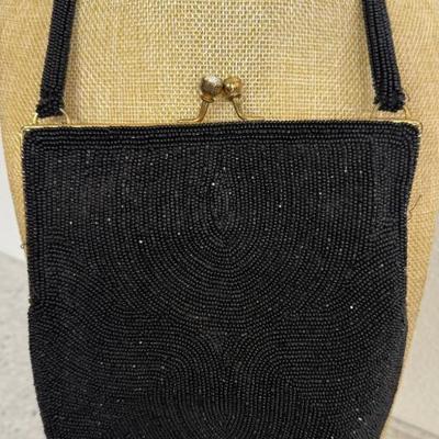 Vintage MCM Black Seed Bead Hand Bag With Kiss Lock Frame And Rhinestone Top
Vintage MCM Black Seed Bead Hand Bag With Kiss Lock Frame...