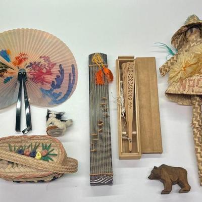 International Lot - (2) Fans, Carved Wood Animals, Mini Gayageum, Woven Straw Doll, And More