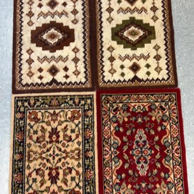 Four Rectangular Woven Wool Mats