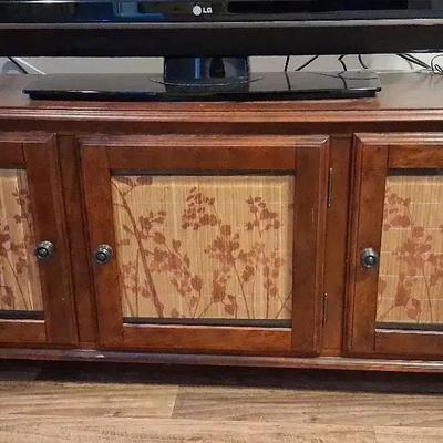 Wooden Entertainment Center with Three Doors & Decorative Glass Panels