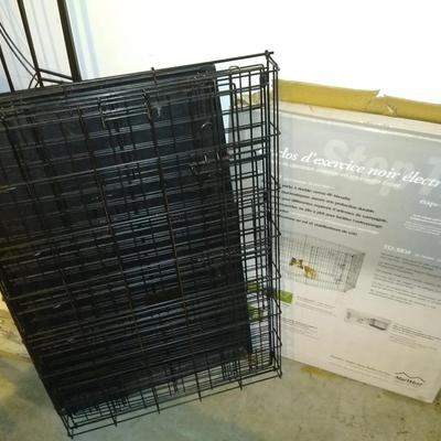 Lot with a dog crate and pen
