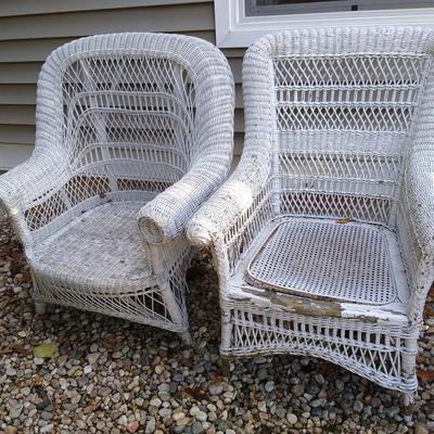 Two white wicker chairs