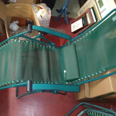 Four folding lounge chairs