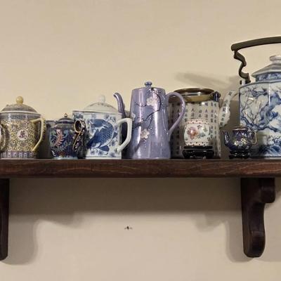 Wooden Shelf of Oriental Tea Pots and Mugs