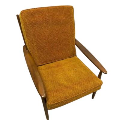 MCM Orange Toned Lounge Chair With Wooden Back And Fabric Cushions
