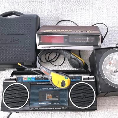 Small Electronics With Vintage Boombox, Clock Radio, And Strobe Light 