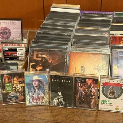 Music Collection With Assorted Rock/Country CDs And Cassette Tapes