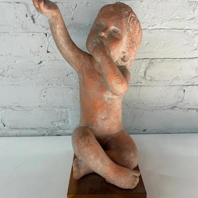 Austin Prod. Terracotta Colored Plaster Sculpture of a Seated Child