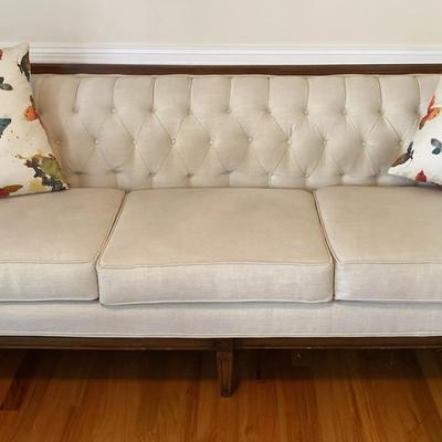 Elegant Tufted Beige Upholstered Sofa with Accent Pillows