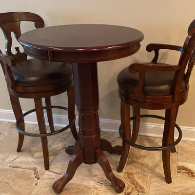 Dark Brown Bar-Height Table with Rotating Chairs