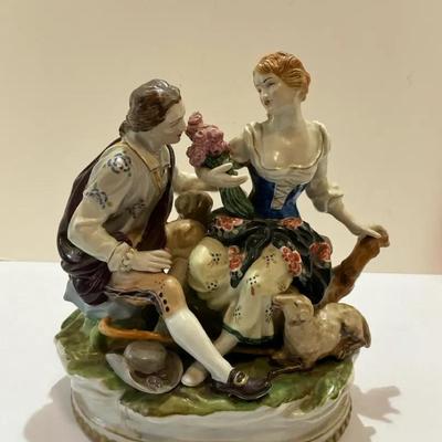 Porcelain Figurine courting couple in a pastoral setting