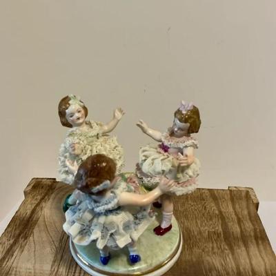 Dresden porcelain figurine, often titled "Ring Around the Roses" or "Ring Around the Rosie"