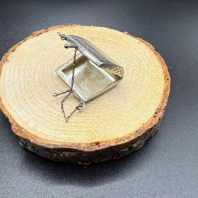 Sterling Silver Miniature Purse - 12.58 Grams
Lot #: 52