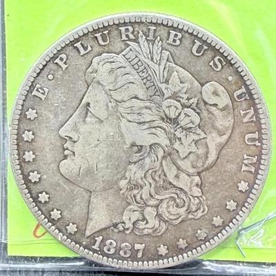 1887 Morgan Dollar 7/6