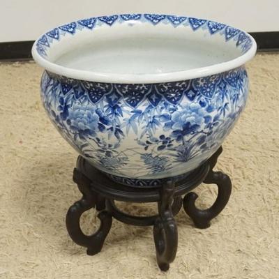 Sale Photo Thumbnail #223: 1214	LARGE ASIAN BLUE AND WHITE POT ON WOOD STAND, APPROXIMATELY 19 IN X 21 IN H TOTAL
