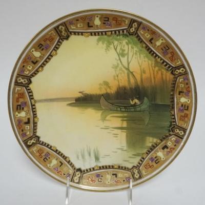 Sale Photo Thumbnail #111: 1110	HAND PAINTED NIPPON WALL PLAQUE, IMAGE OF AMERICAN INDIAN HUNTING ELK IN BIRCH CANOE, APPROXIMATELY 10 1/2 IN 
