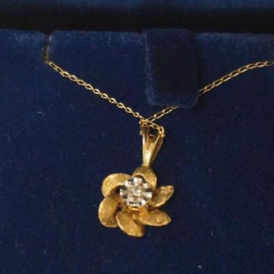 Sale Photo Thumbnail #167: 1159	14K GOLD LADIES FLORAL NECKLACE WITH STONE, NECKLACE HAS KNOT, APPROXIMATELY 18 IN, 1.14 DWT INCLUDING STONE
