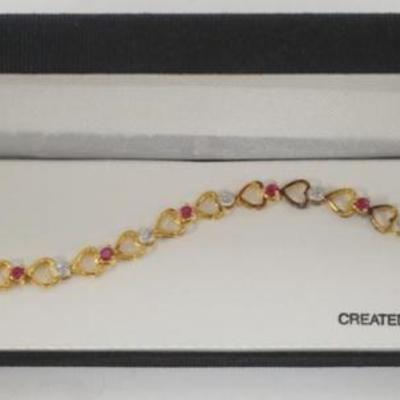 Sale Photo Thumbnail #187: 1179	18K GOLD OVER STERLING SILVER CREATED RUBY AND DIAMOND ACCENT BRACELET
