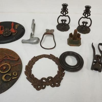 Sale Photo Thumbnail #143: 1135D	GROUP OF METAL ITEMS INCLUDING FIRE MARKERS, CANDLESTICKS, NUTCRACKER, FRAMES, ETC, LARGEST PIECE APPROXIMATELY 13 1/2 IN
