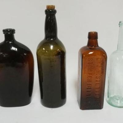 Sale Photo Thumbnail #128: 1127	GROUP OF ANTIQUE BOTTLES INCLUDING DR. HOSTETTER'S STOMACH BITTERS, LARGEST APPROXIMATELY 12 IN H
