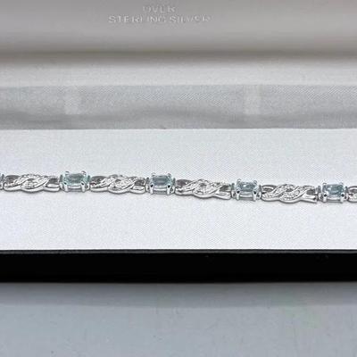 Platinum Over Silver Blue Topaz And Diamond Tennis Bracelet 