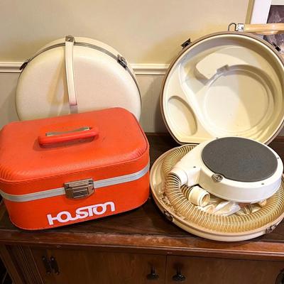 Orange Case and White Cases with Hairdryers