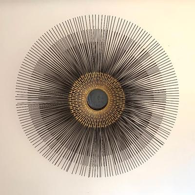 Sale Photo Thumbnail #79: Crate & Barrel starburst wall sculpture.