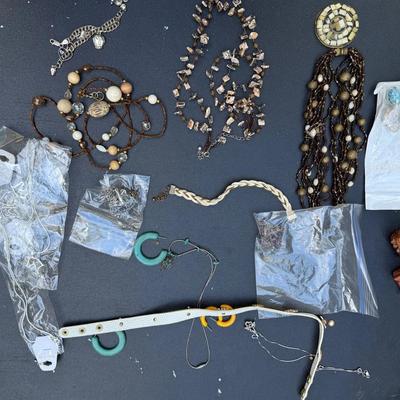 Assorted Costume Jewelry & Hand-Carved Figurine Lot