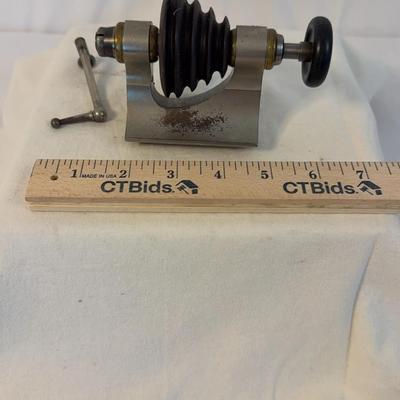 The item shown is an antique watchmaker's lathe tailstock