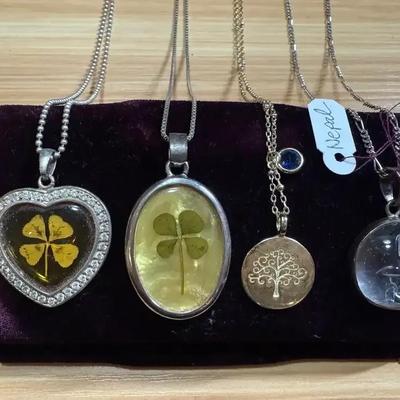 Four pendants necklaces lucky clover others