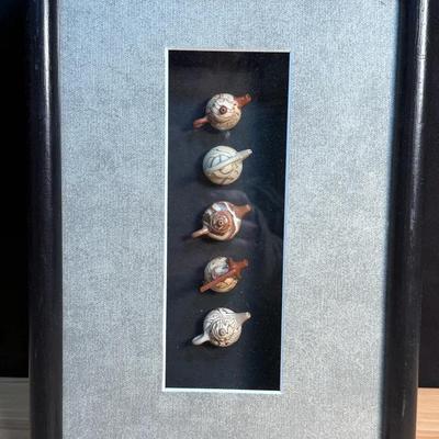 Miniature yixing clay teapots in frame