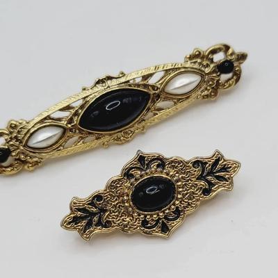 1928 Gold Tone and Black Pin Brooch Pair