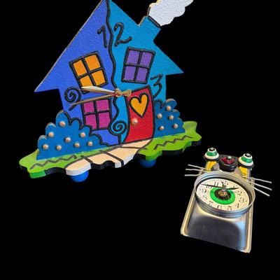 JL502 - Unique Clocks - 2. Largest is approximately 14" tall shortest is approximately 8" tall.