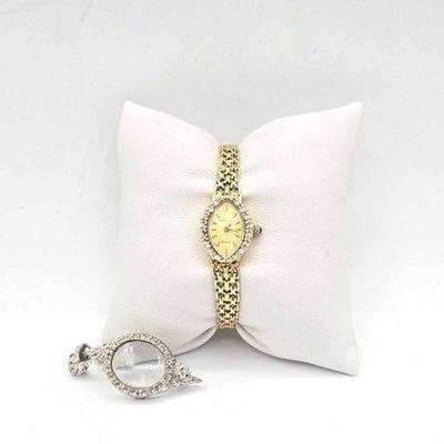 601 • 14k gold and diamond geneve wrist watch, 12.5g