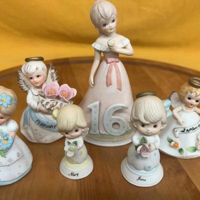 Collection of Enesco 'Growing Up Girls' porcelain birthday figurines