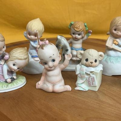 Collection of Lefton/Kelvin Kewpie-style porcelain baby and animal figurines