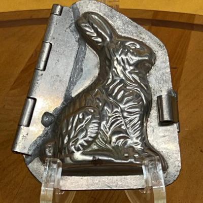 Antique hinged tin chocolate mold in the shape of a detailed rabbit