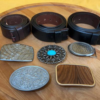 Collection of assorted size 48 leather belts and decorative belt buckles