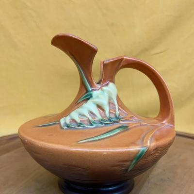 Roseville Pottery Freesia pattern brown ceramic ewer with floral decoration