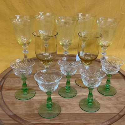 Assorted wine glasses: green stem coupe glass, amber flared, and yellow etched