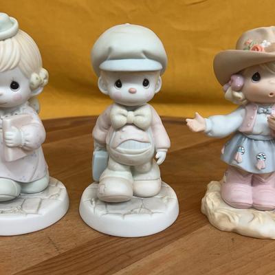 Three Precious Moments porcelain figurines, "Lord Help Me Make The Grade" collection