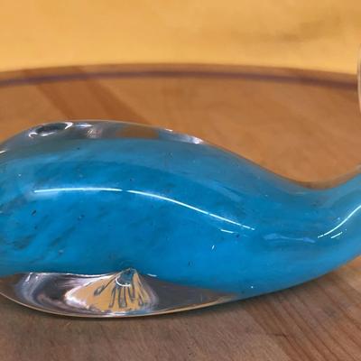 A vintage, hand-blown, blue glass whale figurine, likely Murano-style
