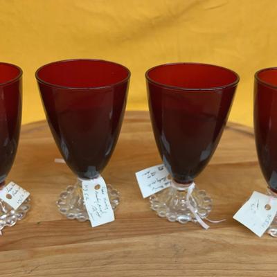 Set of four vintage ruby red glass goblets with boopie feet