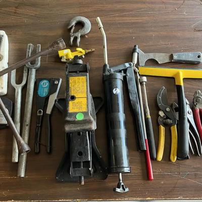 Hand tools featuring a very nice telescoping magnets, scissors jack, grease gun and more.