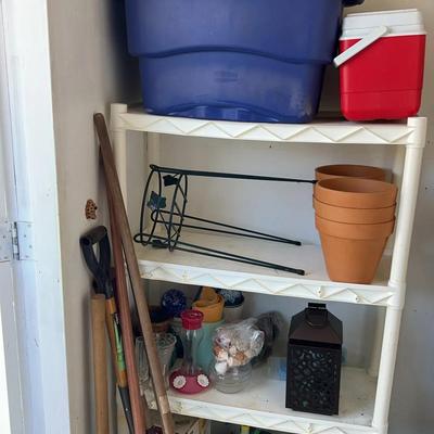 Plastic Shelf With Hand Tools And Coolers